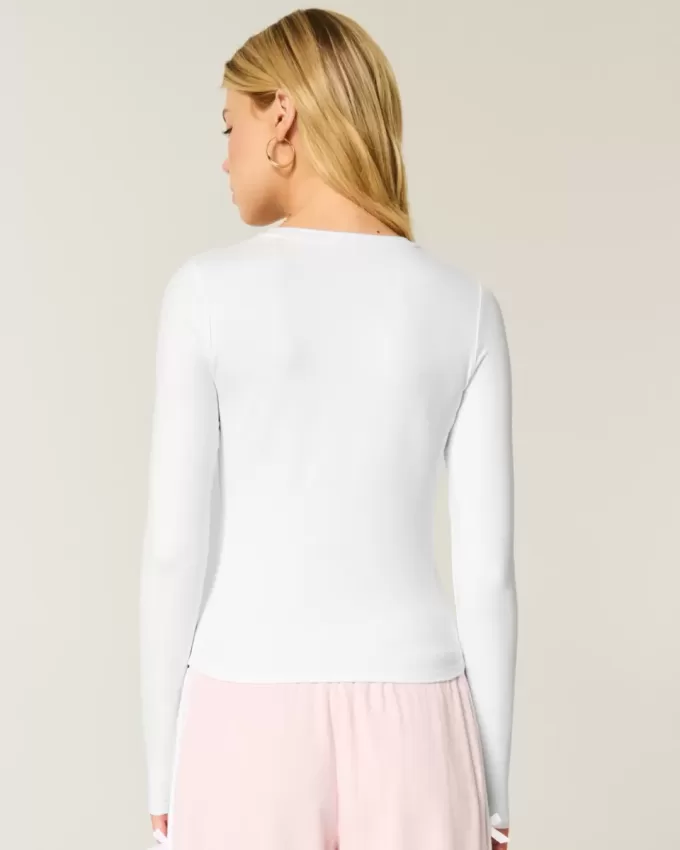 Top de manga larga con cuello redondo y tejido sin costuras Top de manga larga con cuello redondo y tejido sin costuras