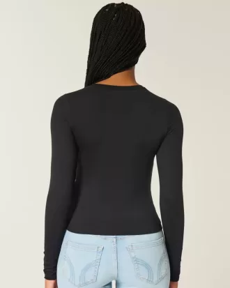 Top de manga larga con cuello redondo y tejido sin costuras Top de manga larga con cuello redondo y tejido sin costuras