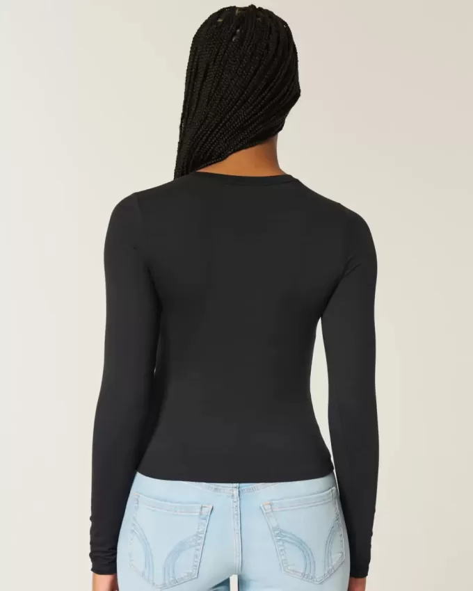 Top de manga larga con cuello redondo y tejido sin costuras Top de manga larga con cuello redondo y tejido sin costuras
