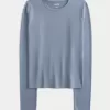Top de manga larga con cuello redondo y tejido sin costuras Top de manga larga con cuello redondo y tejido sin costuras