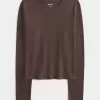 Top de manga larga con cuello redondo y tejido sin costuras Top de manga larga con cuello redondo y tejido sin costuras
