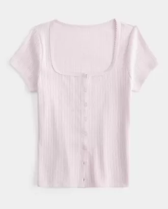 Top de pointelle con botones y manga corta