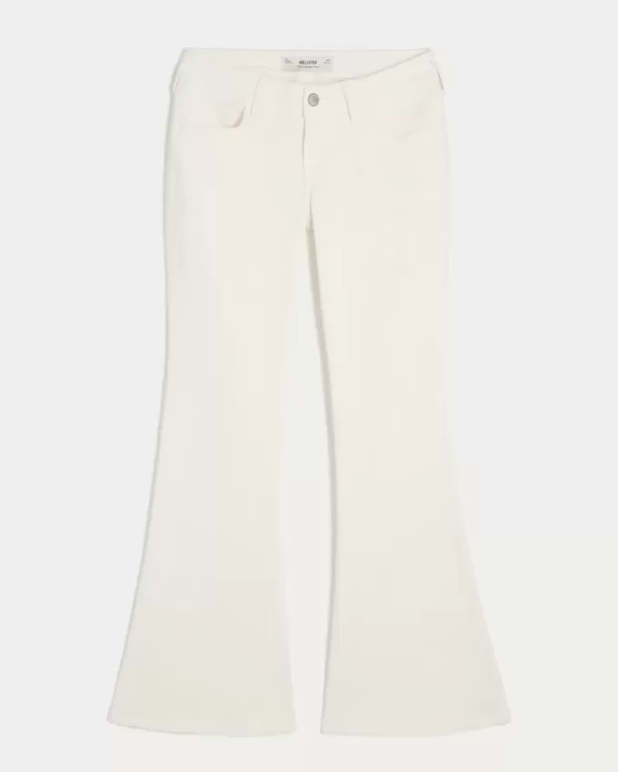 Vaqueros acampanados con bolsillo bordado blanco y tiro ultrabajo Vaqueros acampanados con bolsillo bordado blanco y tiro ultrabajo