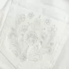 Vaqueros acampanados con bolsillo bordado blanco y tiro ultrabajo Vaqueros acampanados con bolsillo bordado blanco y tiro ultrabajo