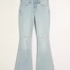 Vaqueros acampanados de tiro alto con lavado claro y rotos Vaqueros acampanados de tiro alto con lavado claro y rotos
