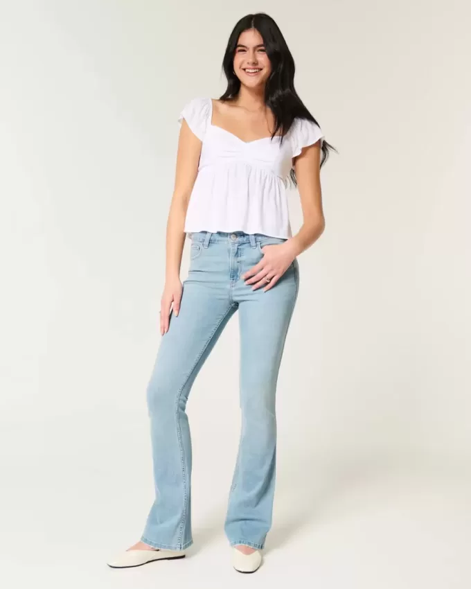 Vaqueros bootcut de tiro medio y lavado claro Vaqueros bootcut de tiro medio y lavado claro