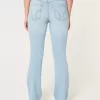Vaqueros de tiro medio con efecto lavado claro y efecto bota curvilíneo Vaqueros de tiro medio con efecto lavado claro y efecto bota curvilíneo