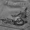 Vaqueros holgados con estampado de patinadores Vaqueros holgados con estampado de patinadores