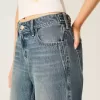Vaqueros holgados de talle bajo con cintura ajustable y lavado medio Vaqueros holgados de talle bajo con cintura ajustable y lavado medio