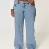 Vaqueros holgados de talle bajo con lavado medio y curvas Vaqueros holgados de talle bajo con lavado medio y curvas