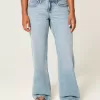 Vaqueros holgados de talle bajo con lavado medio y curvas Vaqueros holgados de talle bajo con lavado medio y curvas