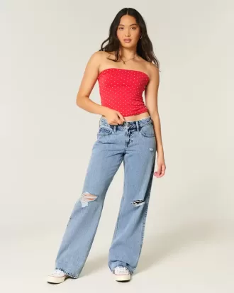 Vaqueros holgados de talle bajo con lavado medio y rotos con curvas Vaqueros holgados de talle bajo con lavado medio y rotos con curvas
