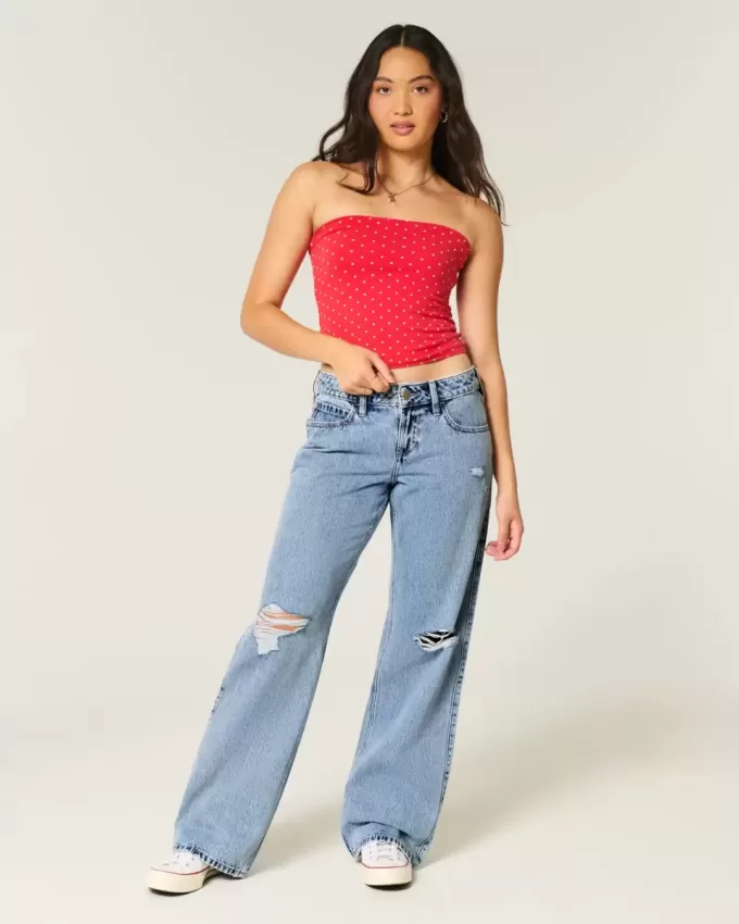Vaqueros holgados de talle bajo con lavado medio y rotos con curvas Vaqueros holgados de talle bajo con lavado medio y rotos con curvas