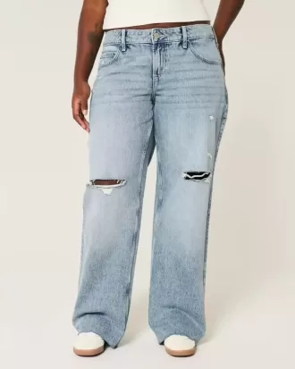 Vaqueros holgados de talle bajo con lavado medio y rotos con curvas Vaqueros holgados de talle bajo con lavado medio y rotos con curvas