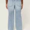 Vaqueros holgados de talle bajo con lavado medio y rotos con curvas Vaqueros holgados de talle bajo con lavado medio y rotos con curvas