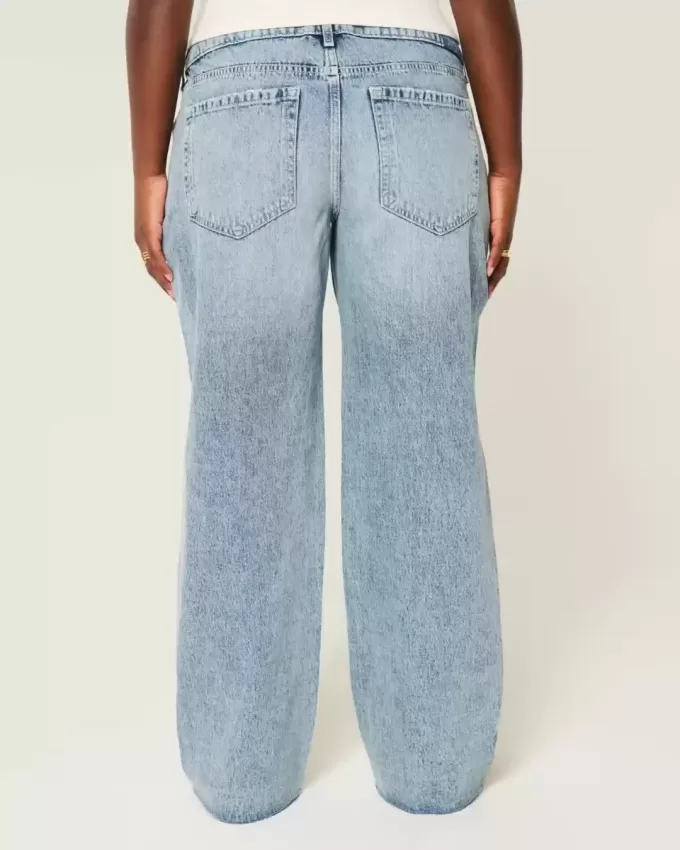 Vaqueros holgados de talle bajo con lavado medio y rotos con curvas Vaqueros holgados de talle bajo con lavado medio y rotos con curvas
