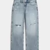 Vaqueros holgados de talle bajo con lavado medio y rotos con curvas Vaqueros holgados de talle bajo con lavado medio y rotos con curvas