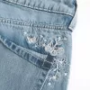 Vaqueros holgados de tiro bajo con lavado medio y estampado de mariposas Vaqueros holgados de tiro bajo con lavado medio y estampado de mariposas