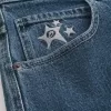 Vaqueros holgados estilo skater con estampado de estrellas y lavado medio Vaqueros holgados estilo skater con estampado de estrellas y lavado medio