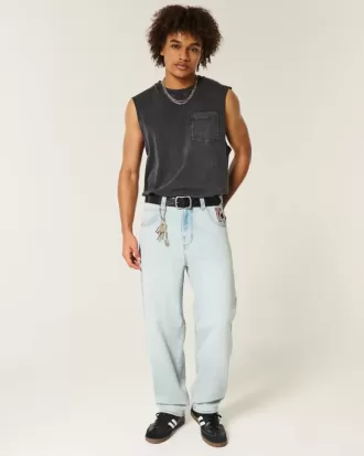 Vaqueros holgados estilo skater con estampado de naipes y lavado claro