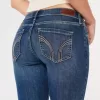 Vaqueros super ajustados de tiro bajo con lavado oscuro y curvas