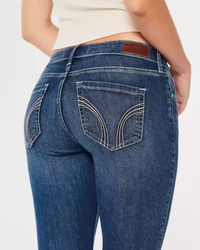 Vaqueros super ajustados de tiro bajo con lavado oscuro y curvas