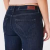 Vaqueros super ajustados de tiro bajo con lavado oscuro y curvas