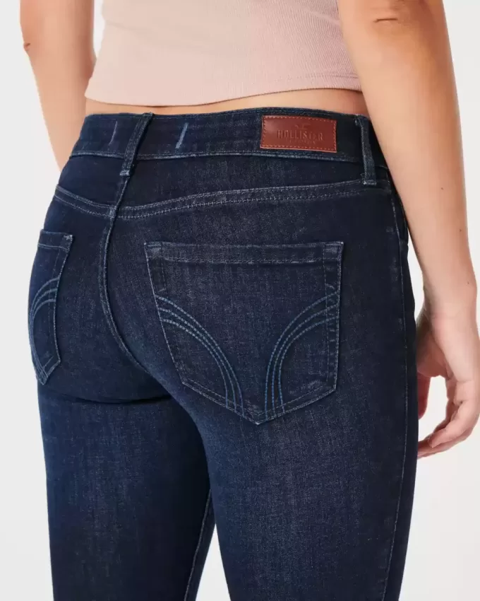 Vaqueros super ajustados de tiro bajo con lavado oscuro y curvas