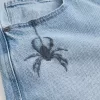 Vaqueros super holgados con estampado de araña y lavado claro Vaqueros super holgados con estampado de araña y lavado claro