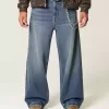Vaqueros super holgados con estampado de dados y lavado oscuro Vaqueros super holgados con estampado de dados y lavado oscuro