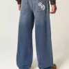 Vaqueros super holgados con estampado de dados y lavado oscuro Vaqueros super holgados con estampado de dados y lavado oscuro