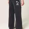 Vaqueros super holgados con estampado de estrellas negras lavadas Vaqueros super holgados con estampado de estrellas negras lavadas