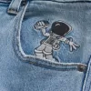 Vaqueros super holgados con lavado claro y gráfico de astronauta Vaqueros super holgados con lavado claro y gráfico de astronauta