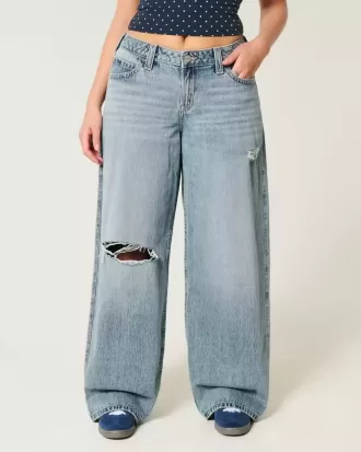 Vaqueros super holgados de talle bajo con lavado medio y rotos con curvas