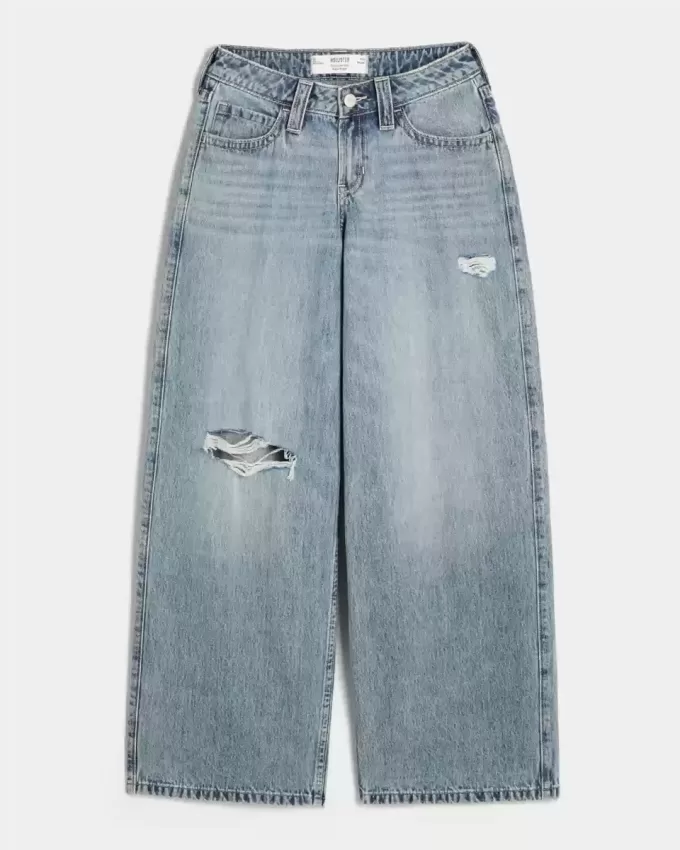 Vaqueros super holgados de talle bajo con lavado medio y rotos con curvas