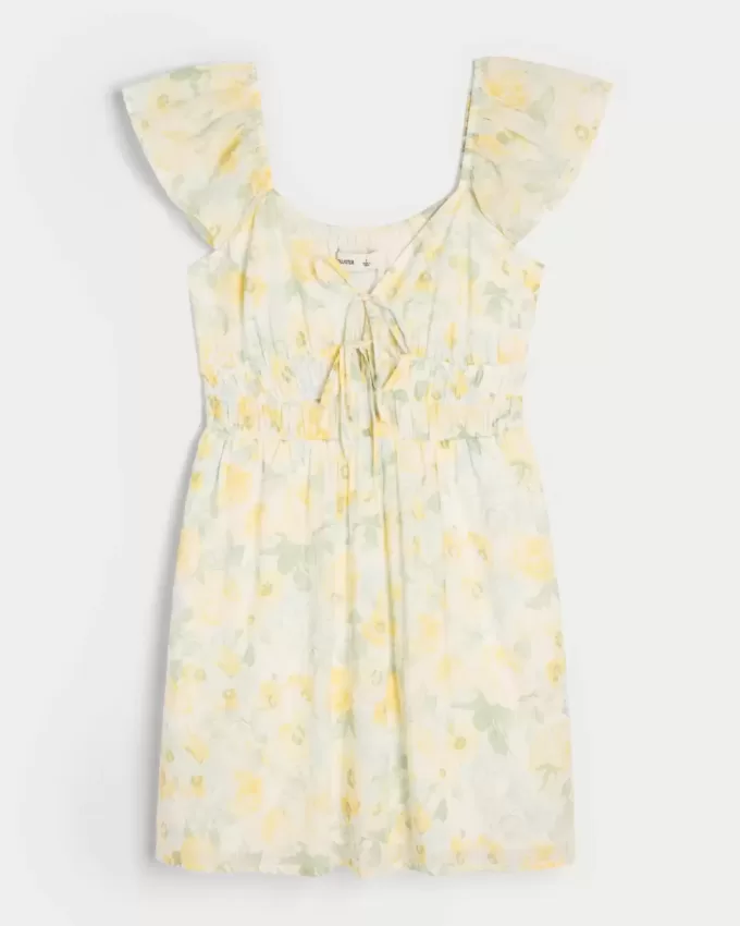 Vestido falda pantalón con doble lazo y mangas onduladas