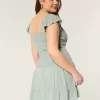 Vestido falda pantalón con mangas onduladas Vestido falda pantalón con mangas onduladas