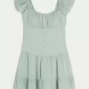 Vestido falda pantalón con mangas onduladas Vestido falda pantalón con mangas onduladas