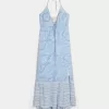Vestido largo halter con dobladillo asimétrico Vestido largo halter con dobladillo asimétrico