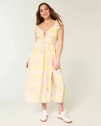 Vestido midi con doble lazo y mangas onduladas