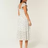 Vestido midi con doble lazo y mangas onduladas Vestido midi con doble lazo y mangas onduladas