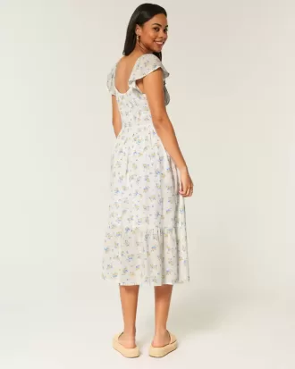 Vestido midi con doble lazo y mangas onduladas