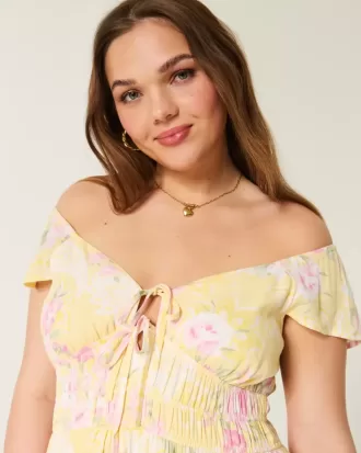 Vestido midi con doble lazo y mangas onduladas