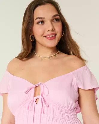 Vestido midi con doble lazo y mangas onduladas