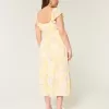 Vestido midi con doble lazo y mangas onduladas Vestido midi con doble lazo y mangas onduladas