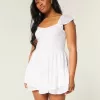 Vestido minifalda con mangas onduladas y busto ajustado Vestido minifalda con mangas onduladas y busto ajustado