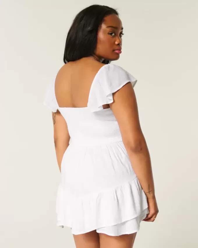 Vestido minifalda con mangas onduladas y busto ajustado Vestido minifalda con mangas onduladas y busto ajustado
